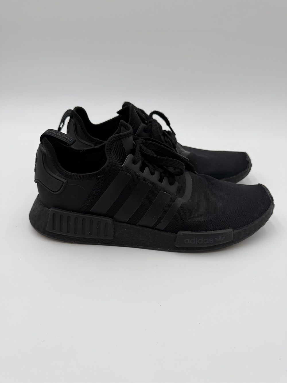 Men’s Adidas NMD_R1 sneakers in a Triple Black colorway Sz 12